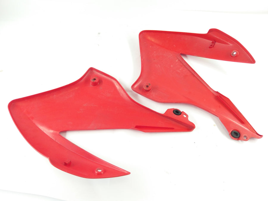 Honda XR 125 L JD19 [2005] - rivestimento laterale a destra e a sinistra con crack